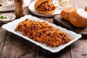 Pulled bbq chicken on a serving plate photo