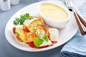 Breakfast egg burrito with grits photo