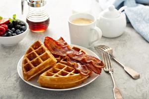 Breakfast plate with waffles and bacon photo