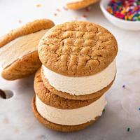 Ice cream and cookies sandwiches stacked on the table photo