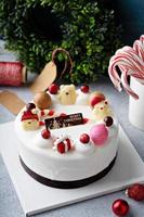 White chocolate Christmas celebration cake with holiday decorations