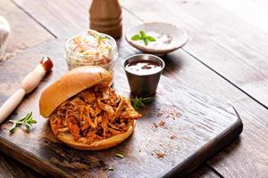 Pulled bbq chicken on a brioche bun photo