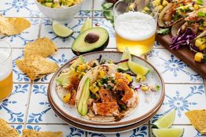 Fish tacos with mango salsa and red cabbage photo