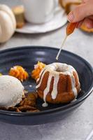 Fall plated dessert with a spice cake, ice cream and pumpkin mousse photo