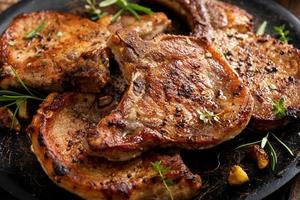 Grilled or pan fried pork chops on the bone photo