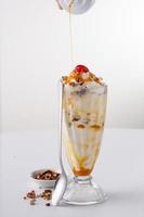Caramel pecan ice cream sundae photo