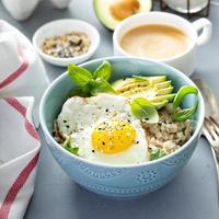 Savory oatmeal with egg and avocado photo