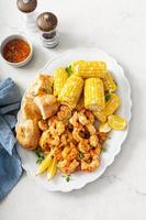 Spicy shrimp and corn on the cob, summer recipe photo
