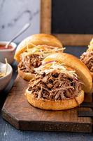 Pulled pork sandwiches with cole slaw on brioche buns photo