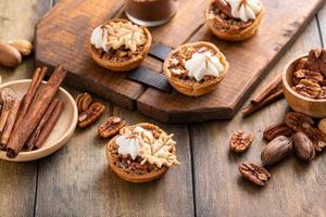 Mini pecan pies baked in a muffin tin photo