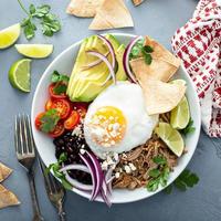 Breakfast burrito bowl with pork carnitas and rice photo