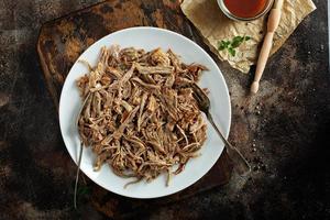 Pulled pork with forks on a plate photo