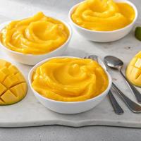 Mango ice cream or nice cream, blended frozen mango dessert photo