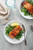 Grilled salmon served with green beans photo