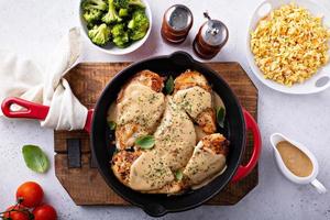 Cooked chicken breast in a skillet photo