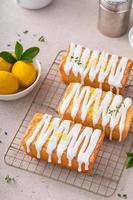 Classic lemon pound cake with powdered sugar glaze dripping over photo