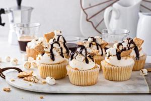 Smores cupcakes with graham crackers, toasted marshmallows and chocolate photo