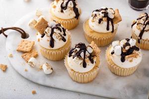 Smores cupcakes with graham crackers, toasted marshmallows and chocolate photo