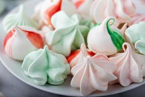 Peppermint meringues on a marble table, Christmas treat photo