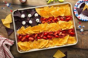 American flag nachos on a big tray with chips and salsa photo