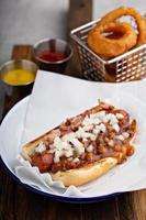 Chili hot dog with beans and onion photo