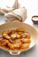 Fried caramelized plantains in a pan photo