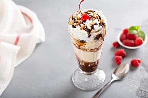 Ice cream, chocolate and whipped cream parfait photo