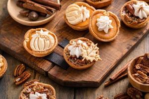 Mini pumpkin and pecan pies baked in muffin tin photo