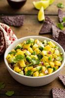 Pineapple and cucumber salsa with jalapeno and red onion photo