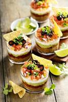Seven layer dip in individual cups, mexican appetizer photo