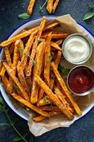 Sweet potato fries with sauces photo