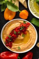 Roasted pepper hummus with pita photo