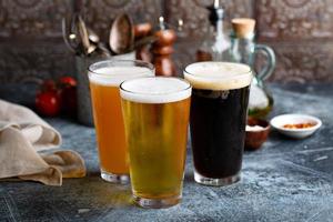 Assortment of beer in tall glasses photo