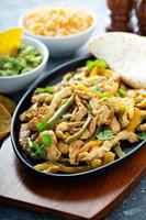 Chicken and bell peppers fajitas photo