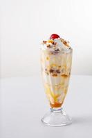 Caramel pecan ice cream sundae photo