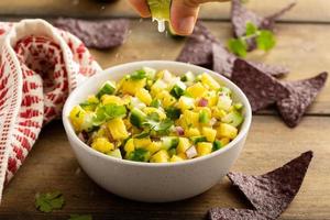 Pineapple and cucumber salsa with jalapeno and red onion photo