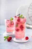 Spring or summer cocktail with raspberry and mint photo