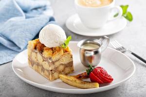 Warm apple bread pudding with ice cream photo