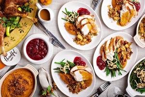 Traditional Thanksgiving plates with turkey and sides