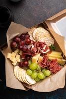 Cheese and meat assortment in a to go box photo
