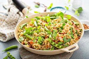 Breakfast fried rice with bacon and peas