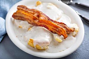 Biscuits and gravy with bacon for breakfast photo