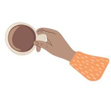 Hand holding cup of coffee. Top view vector