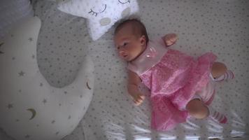 close up of Cute little newborn girl in pink dress video