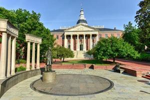 Thurgood Marshall Monument beside the Maryland State Capital building in Annapolis, Maryland on summer afternoon. It is the oldest state capitol in continuous legislative use, dating to 1772. photo