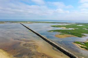 Provincetown Causeway also known as the Breakwater Walk, is an uneven collection of rocks that allows hikers to cross the harbor and reach the very tip of the Cape. photo