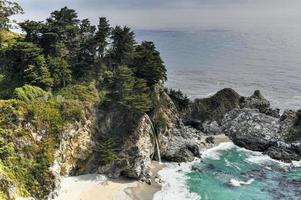 McWay Falls is an 80-foot-tall waterfall on the coast of Big Sur in central California photo