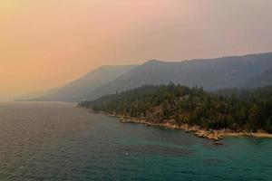 Secret Cove along Lake Tahoe in Nevada with a hazy sky due to nearby forest fires in California. photo