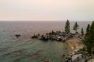 Secret Cove along Lake Tahoe in Nevada with a hazy sky due to nearby forest fires in California. photo