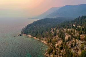 Secret Cove along Lake Tahoe in Nevada with a hazy sky due to nearby forest fires in California. photo